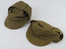 Two military ski type hats in green fabric, Russian? text and numbered 54.