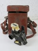 A WWII US M4 60mm Mortar sight in original leather transit case, with serial number.