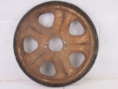 A WWII German SD.Kfz. 251 track wheel with some original rubber 'tyre'.