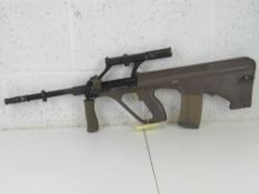 A deactivated Steyr AUG 5.56mm Assault Rifle.
