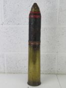 An inert WWI British 18pr shell, the head is semi relic with a B.S.C No.85 fuze dated 1916.