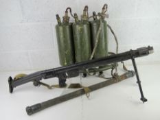 A deactivated LPO-50 Flame Thrower with connector hose and tanks.