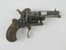 An antique Pinfire 6mm Calibre Revolver with fold down trigger.