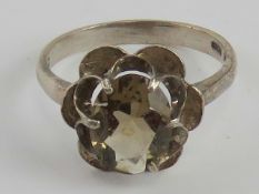 A hallmarked silver smoky quartz ring, the oval cut stone measuring approx 10 x 7.