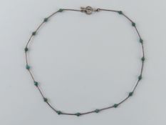 A South American silver bracelet having hinged panels featuring Llamas upon and set with hard