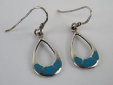 A pair of silver and turquoise earrings stamped 925. In presentation box.