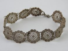 A Sterling silver filigree panel bracelet, 19cm in length.