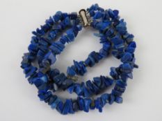 A silver and lapiz lazuli three row bracelet.