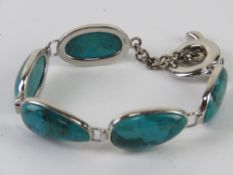A finely made silver and turquoise five panel bracelet, stamped 925 throughout, approx 19.