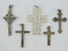 Four silver crucifix and Celtic cross pendants,