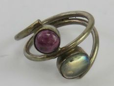 A silver and hardstone ring having garnet in matrix and moonstone?, stamped 925, size L-M.
