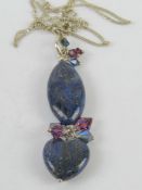 A handmade lapis lazuli pendant measuring 6.5cm inc bale on 925 silver chain.