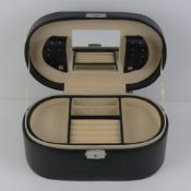 A contemporary black leather jewellery box, 26cm wide.