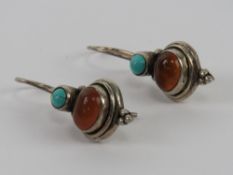 A pair of silver Native American style carnelian and turquoise earrings, stamped 925, 3cm drop.