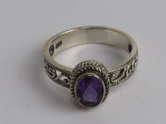A silver and amethyst ring, stamped 925, size Q.