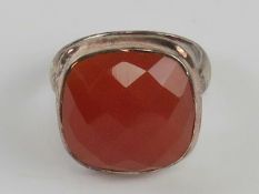 A silver and carnelian ring faceted cabachon approx 16 x 16mm, stamped 925, size P.
