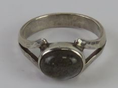 A handmade silver labradorite cabachon ring having planished band stamped 925, size N.