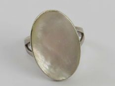 A silver and mother of pearl ring stamped 925, size L.