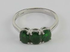 A 9ct white gold Russian diopside trilogy ring size N-O 2.4g.