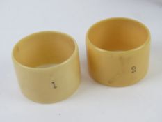 A hunting themed stock pin having yellow metal terminal in the form of a stirrup within original