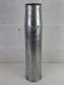 An inert 105mm shell case.