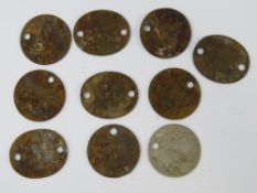 Ten WWII British issued dog tags.