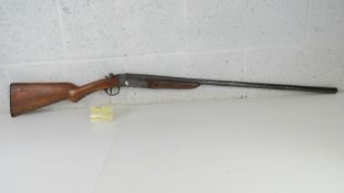 A deactivated Webley and Scott 12 Gauge