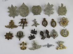 Twenty-three assorted cap badges inc; Ar