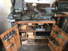 A Myford Super 7 benchtop lathe with attached made to measure base having two doors opening to