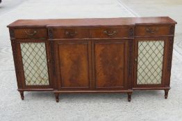 A smart Georgian style reproduction break front chiffonier having four drawers,