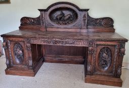 A fine and impressive Victorian carved oak chiffonier sideboard.