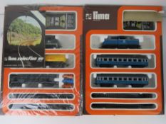 Two HO scale Lima Model railway sets.
