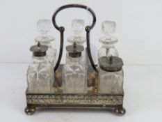 A silver plated and cut glass cruet, 19.5cm wide.