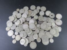 A quantity of pre-1947 coinage mostly half silver, some full silver noted. Total weight 1147.
