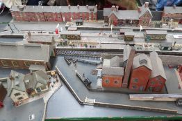 A quantity of model railway diorama makers buildings and part build diaramas including street