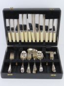 A leatherette canteen of cutlery, knife blades marked for Dixon & Sons Ltd.