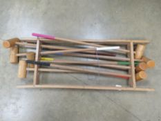 A quantity of wooden croquet mallets.