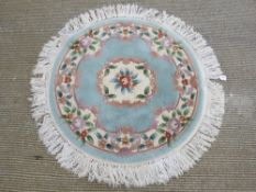 A round woolen rug, 120cm dia.