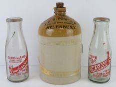 A salt glazed JKH Fowler Wine & Spirit Merchant Aylesbury stoneware jug standing 26.