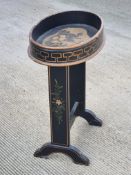 A hand painted and ebonised oval occasional table, 50 x 32cm approx.