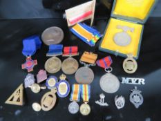 A pair of miniature WWI medals being War and Peace medals with ribbons on bar,