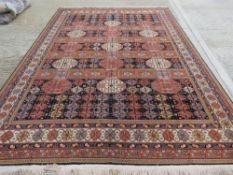 A large woolen rug, 380 x 270cm.