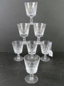 A set of seven crystal wine glasses having maker's mark to base.