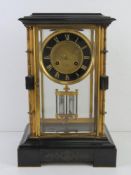 A late 19th century French four glass architectural black slate mantle clock by Hry Marc Paris,