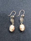 A pair of 9ct gold carved shell cameo earrings.