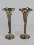 A matched pair of HM silver bud vases each standing approx 17cm high.