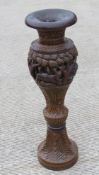 A contemporary carved wooden planter of Indo Asian influence, 90cm high.