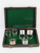 A pair of HM silver napkin rings together with six assorted HM silver napkin rings.