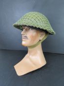 A WWII Far East British Army Brodie helmet.