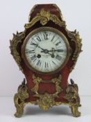 A late 19thC mantle clock having white enamelled dial marked for Howell & Games (?? indistinct),